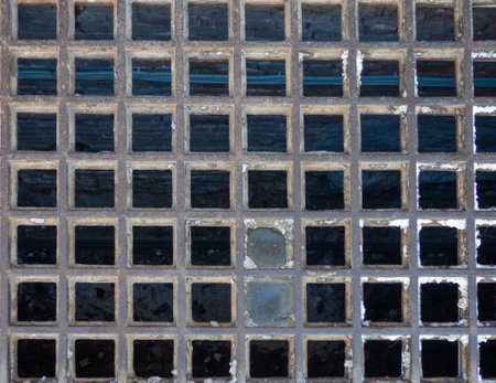 Checkered lattice. The texture of the old building. Lattice of a ruined abandoned buildingの写真素材