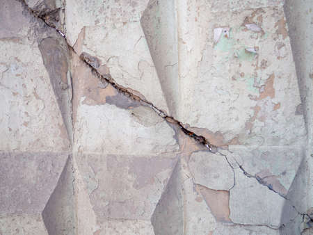 concrete wall with a crack. Concrete construction. Background from a stone with a crackの写真素材