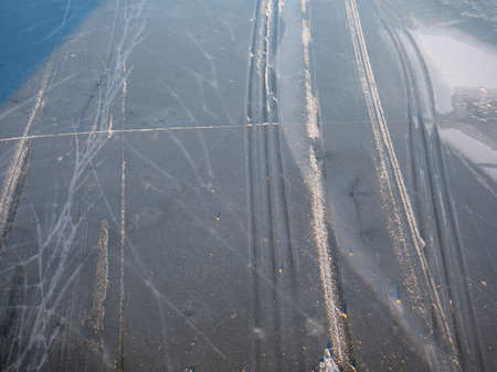 City landscape. Ice on the river. Top view of a snowmobile track. Ski track. Nature in the cityの写真素材