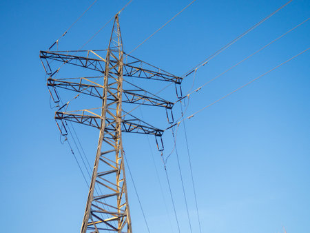 Power line. Pillar. Metal tower. Electricity in the city. Technologies.の写真素材