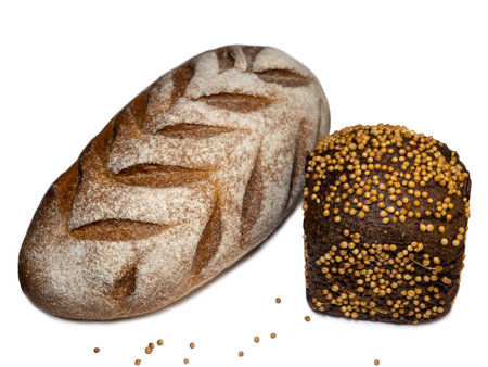 Black bread and borodino bread sprinkled with coriander.  Flour products. Bread with spices on white backgroundの写真素材