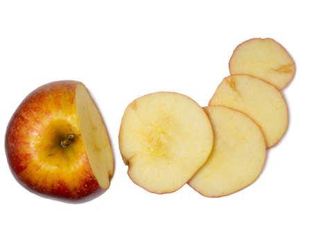 A large red apple cut into wedges. Fresh fruit isolate.Smoothly sliced ââapple wedgesの写真素材