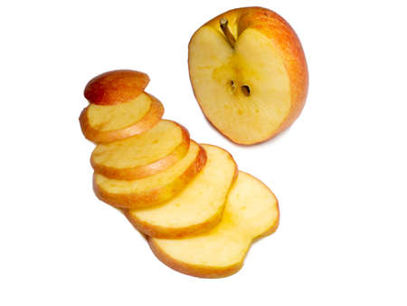 A large red apple cut into wedges. Fresh fruit isolate.Smoothly sliced ââapple wedgesの写真素材