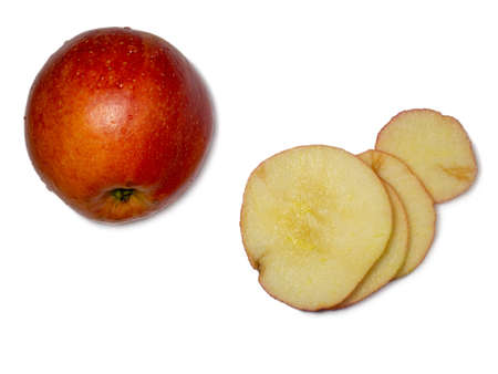 A large red apple cut into wedges. Fresh fruit isolate.Smoothly sliced ââapple wedgesの写真素材