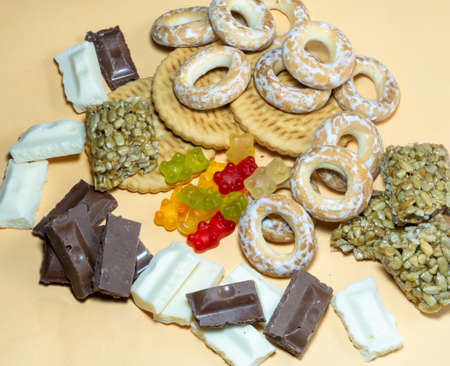 Background from different sweets. Sweets and flour products  on the table. Unhealthy foodの写真素材