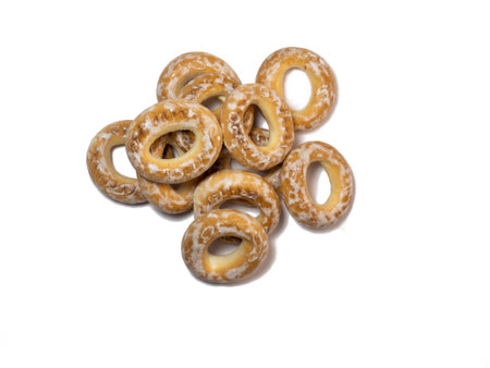 Isolate from dryers in glaze. A handful of bagels on a white background. Sweet foodの写真素材