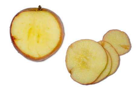 A large red apple cut into wedges. Fresh Fruit Isolateの写真素材