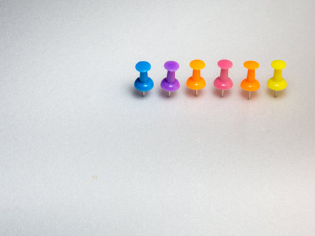 colored memothumb tacks. Stationery on white background. necessary for the officeの写真素材