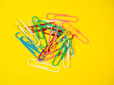 Large multi-colored paper clips. Paperclip of documents. Desktop. Bright stationeryの写真素材