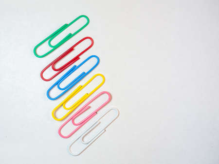 Large multi-colored paper clips. Paperclip of documents. Desktop. Bright stationeryの写真素材