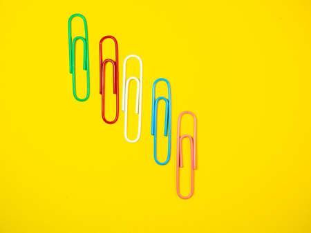 Large multi-colored paper clips. Paperclip of documents. Desktop. Bright stationeryの写真素材