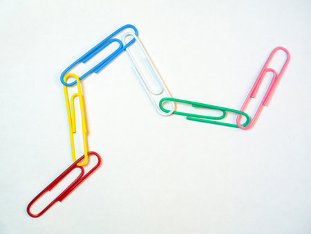 Large multi-colored paper clips on a white background. Paperclip of documents. Desktop. Bright stationeryの写真素材