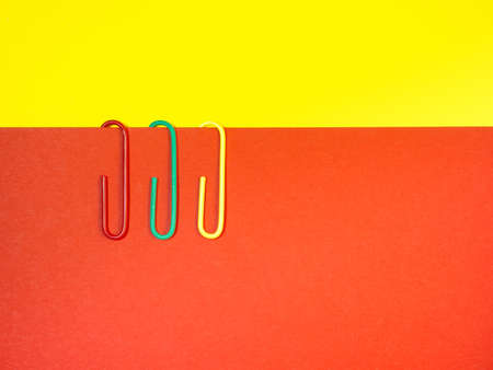 Large multi-colored paper clips. Paperclip of documents. Desktop. Bright stationeryの写真素材