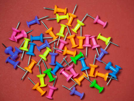 Paper work. Colored paper clips. Colored paper with staples. Work with documents. Office. Colorful office supplies.の写真素材