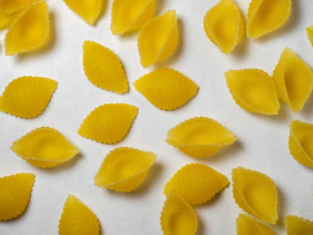 Shell-shaped pasta on the table. Italian food. Cooking food. durum wheatの写真素材
