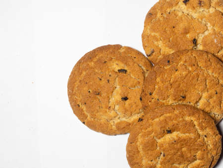 Oatmeal raisin cookies on a white background. Sweets.  tea biscuits. Treats to the tableの写真素材