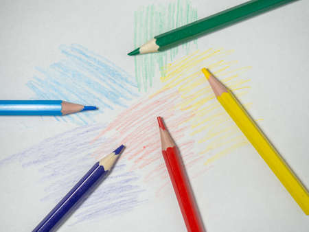 Colored wooden pencils on colored paper. sharpened pencils. drawing tool. painting. Accessories for creativity.の写真素材