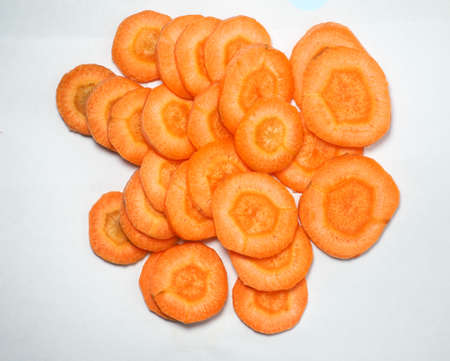 sliced ââcarrot. Carrot slices on a white background. Vegetarian food. vitamins. fresh vegetablesの写真素材