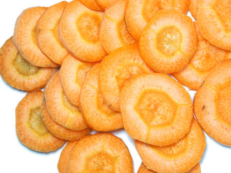 sliced ââcarrot. Carrot slices on a white background. Vegetarian food. vitamins. fresh vegetablesの写真素材