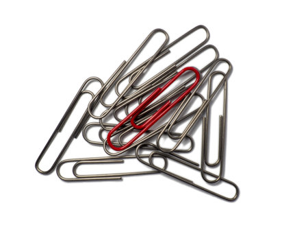 Metal paper clips on a white background. office supplies isolate. ideas. The concept of loneliness....