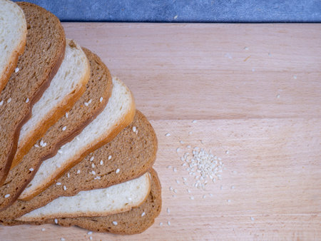 Sliced â€‹â€‹bread for breakfast. food on the table. Flour products. Buns with sesame...