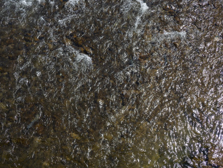 Rapid flow of the river. Big river, view from above. View from the bridge to the water. Thresholds...