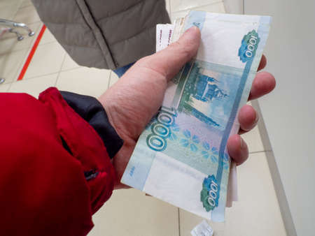 finance. Russian money. money in hand. Payment of utility servicesの写真素材