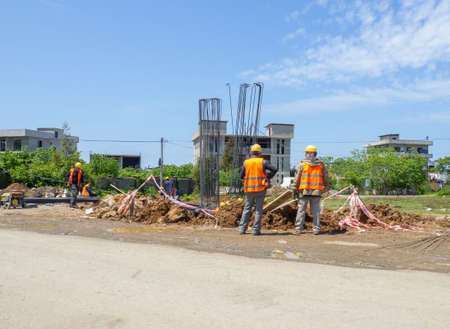 bridge building. Builders at work. foundation laying. The work of a construction company. buildings on the outskirts of the cityの写真素材