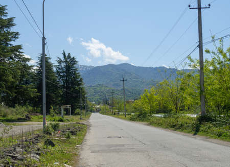 Country road leading to the mountains. Roadway Asphalt road in a beautiful location. natureの写真素材