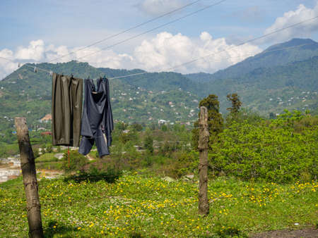 Things are dried on a rope in the mountains. beautiful place. country life. Drying laundry in natureの写真素材