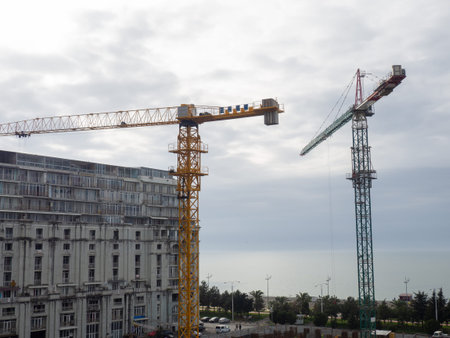 construction cranes. view from above. Start of construction. skyscraper foundation. workers....