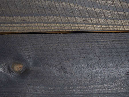 Background from burnt boards. blackwood. Burnt wood wall. boards after the fire. Textureの写真素材