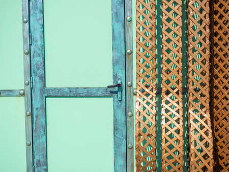 An interesting design door. Entrance. closed door. colored wall.の写真素材
