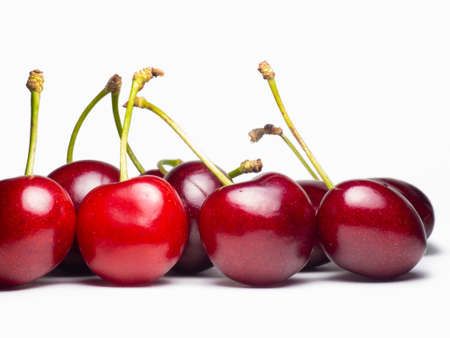 Juicy cherries on a white background. Useful food. Beautiful berries isolate. Ripe berries on the table. Ingredient for a dish. Freshの写真素材
