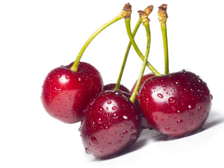 Juicy cherries in water droplets on a white background. Useful food. Beautiful berries isolate. Ripe berries on the table. Ingredient for a dish. Freshの写真素材