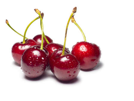 Juicy cherries in water droplets on a white background. Useful food. Beautiful berries isolate. Ripe berries on the table. Ingredient for a dish. Freshの写真素材