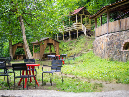 Beautiful restaurant in the mountains. Empty tables of a diner in the woods. Restaurant in nature. Georgiaのeditorial素材