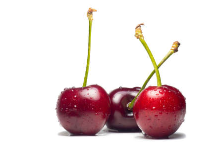Juicy cherries in water droplets on a white background. Useful food. Beautiful berries isolate. Ripe berries on the table. Ingredient for a dish. Freshの写真素材