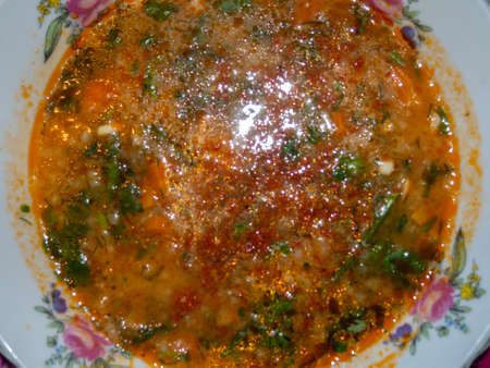 A bowl of vegetable soup. view from above. Rural life. The first dish is red. healthy diet. Soup for a healthy lifestyle loverの写真素材