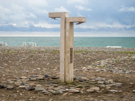 shower on the beach. Washbasin on the beach. Public accessible shower after swimming. Sulfur sea beach.の写真素材