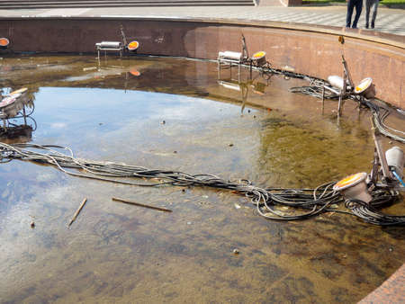 Equipment for dancing fountains. Drained fountain in the park. without water. Devices inside the fountains. Technologyの写真素材