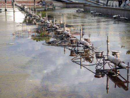 Equipment for dancing fountains. Drained fountain in the park. without water. Devices inside the fountains. Technologyの写真素材