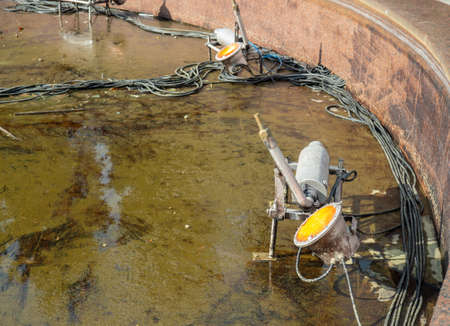 Equipment for dancing fountains. Drained fountain in the park. without water. Devices inside the fountains. Technologyの写真素材