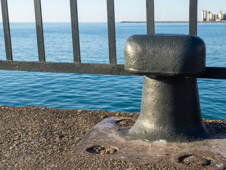 ship parking place. A bollard for tying a ship. Place for mooring. sea transport. Black bollardの写真素材