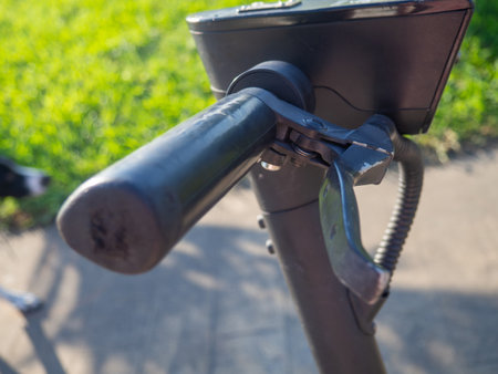 Part of an electric scooter close-up. Electric scooter hand brake. Propulsion tool. Vehicles for funの写真素材