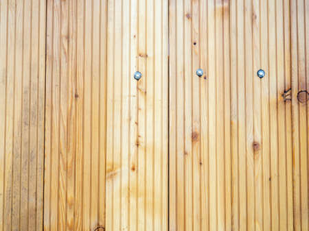 plank wall. Nailed planks of light wood. beautiful wood. Background of ribbed boardsの写真素材