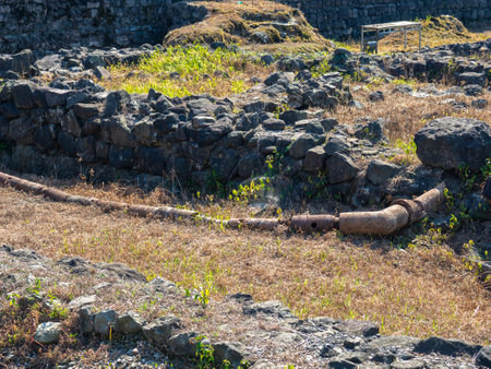 Ruin of an old castle. Remains of civilization. Fortress in Georgia. old stones. The city of ancient stone masonry. Site of archaeological finds. ancient plumbing. Remains of clay pipesの写真素材