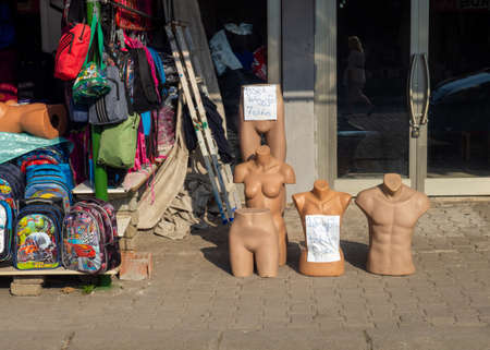 Hope, Turkey. 09/08/2022 A stall in a street market. Market in a Turkish town. Sale of clothes. clothes store. Mannequins on the counter. Parts of mannequinsの写真素材
