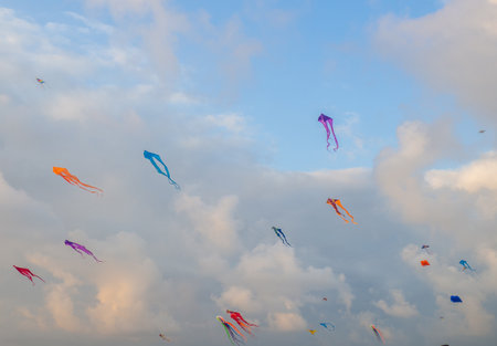 Lots of kites in the sky. kite festival. colorful toys. launch kits. Beauty in the sky Leisure entertainment. windy weatherの写真素材