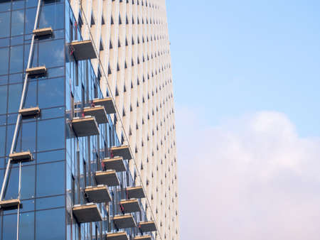 Part of a high-rise building under construction. End of construction. Finished works. Facade of a new beautiful skyscraper. modern engineering. resort townの写真素材